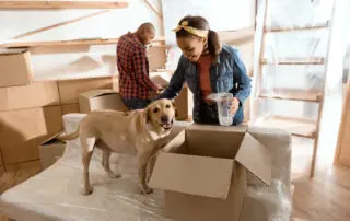 Couple with labrador dog moving to new home