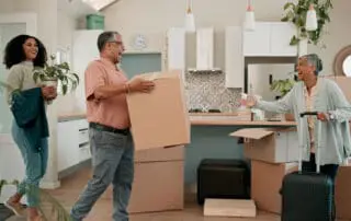 Senior parents, woman and boxes in new home for help, support or luggage with family at property. People, mother and dad with moving, suitcase or excited for investment in real estate for retirement