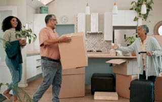 Senior parents, woman and boxes in new home for help, support or luggage with family at property. People, mother and dad with moving, suitcase or excited for investment in real estate for retirement